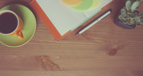 Table with coffee and plant